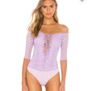 Purple revolve bodysuit